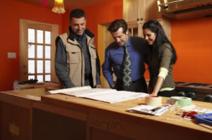 homeowner and architect looking at home improvement plans